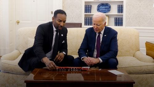 Atlanta Mayor Andre Dickens visits with President Joe Biden in the Oval Office to discuss infrastructure improvements made in the city with the help of federal funding. Courtesy of White House