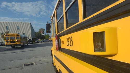 Gwinnett County’s school system is purchasing more school buses like this one to update its aging fleet. AJC FILE PHOTO