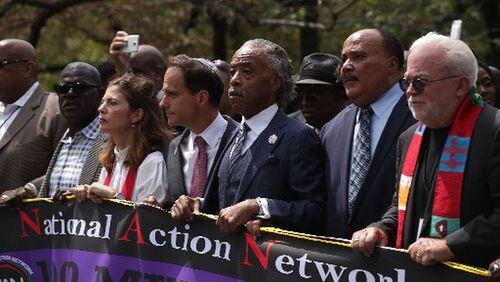 The Rev. Al Sharpton, Martin Luther King III and Rabbi Jonah Pesner lead the 1,000 Ministers March for Justice in Washington Monday. (Alex Wong/Getty Images)