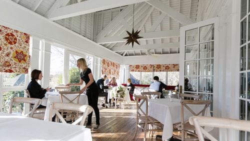 The Farmhouse offers wooded views from its glass porch. CONTRIBUTED BY J. ASHLEY PHOTOGRAPHY