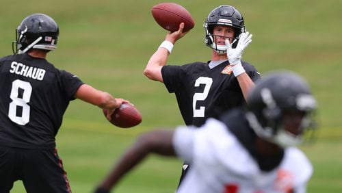 QBs in action: Matt Ryan throws a pass to wide receiver Calvin Ridley while Matt Schaub prepares to throw in another direction during Wednesday's minicamp activities in Flowery Branch. (Curtis Compton/ccompton@ajc.com)