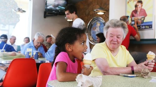 July 1, 2019 Buckhead- Catherine (left) enjoys her vanilla ice cream cone while Barbara (left) looks on during the 70th anniversary celebration for Zesto Atlanta at their Buckhead location off of Piedmont Road NE on Monday, July 1, 2019. Zesto opened in 1945 nationally, moving to Atlanta in 1949. The restaurant eventually had six locations in Atlanta, remaining family owned and operated through its expansion. Today there are four Zesto locations remaining in Atlanta. Zesto celebrated its 70th anniversary with 70 cent chili dogs for its customers, who packed the restaurant during the morning of the all-day celebration. Christina Matacotta/Christina.Matacotta@ajc.com