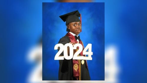 Darrell Bryant poses for graduation photos, a significant occurrence since he is only 16-years-old. (Photo Courtesy of Upscale Images)