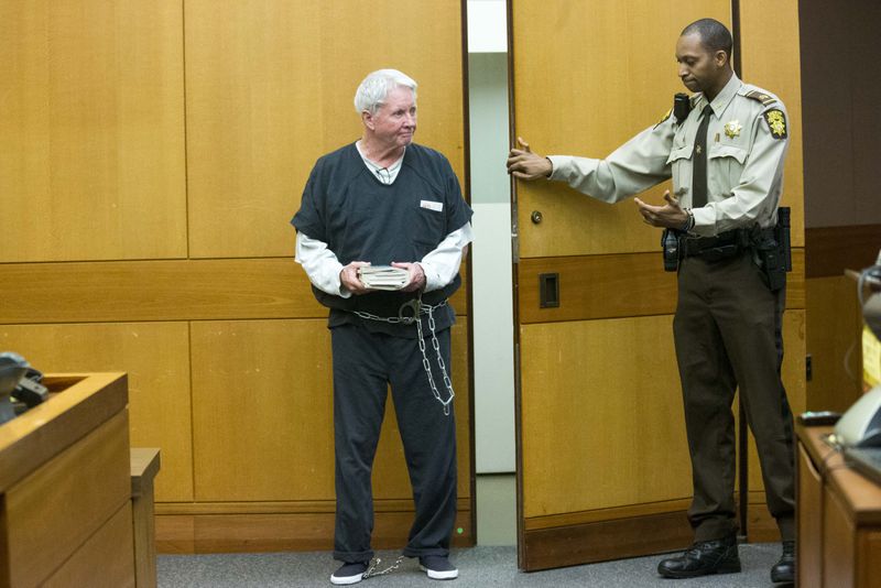 05/23/2018 -- Atlanta, GA -- Claud "Tex" McIver enters the courtroom holding a bible filled with papers before his sentencing in front of Fulton County Chief Judge Robert McBurney at the Fulton County courthouse in Atlanta, Wednesday, May 23, 2018. McIver was sentenced to life in prison with a possibility of parole. ALYSSA POINTER/ATLANTA JOURNAL-CONSTITUTION