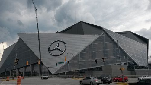 The Atlanta Falcons and Atlanta United will play in the new Mercedes-Benz Stadium in downtown Atlanta. The completion of the project was pushed back months. One of the troubles was a complex retractable roof, which officials now say won't be fully automated until later this season. MATT KEMPNER / AJC