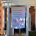 This banner was placed outside the Alpha Chi Omega sorority house at the University of Georgia, where Laken Hope Riley was a member. Riley, a 22-year-old nursing student, was found dead in a wooded area on the UGA last Thursday. Police have charged Venezuelan national Jose Antonio Ibarra, whom authorities say entered the U.S. unlawfully, with murder. (Fletcher Page / fletcher.page@ajc.com)