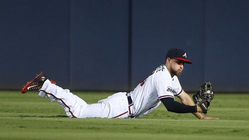 Braves center fielder Ender Inciarte made a diving catch to rob the Cleveland Indians’ Jose Ramirez of a hit on June 27. (AP Photo/John Bazemore)