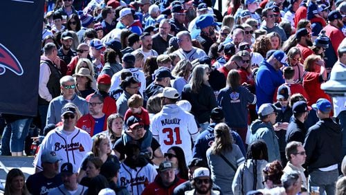 Baseball fans wait for gates to open before a game at Truist Park, Friday, April 5, 2024, in Atlanta. (Hyosub Shin / Hyosub.Shin@ajc.com)