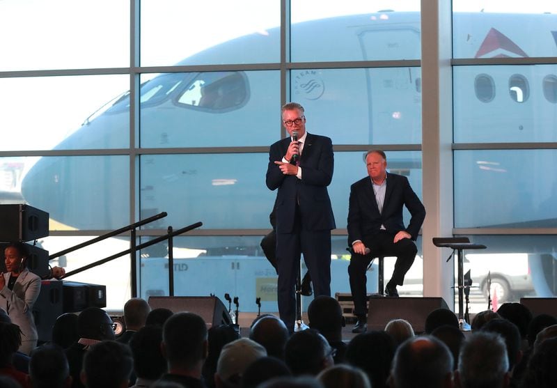 Delta CEO Ed Bastian (left) and COO Gil West unveil the new A220 aircraft while celebrating the 10-year anniversary of merging with Northwest at the Delta Air Lines TechOps on Monday, Oct 29, 2018, in Atlanta.  Curtis Compton/ccompton@ajc.com