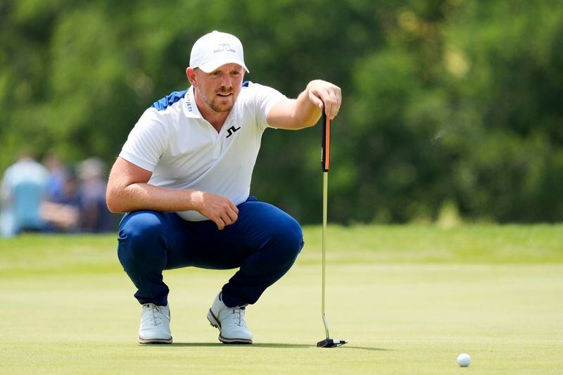 Matt Wallace, of England, lines up a putt on the first hole during the third round of the Byron Nelson golf tournament in McKinney, Texas, Saturday, May 4, 2024. (AP Photo/LM Otero)