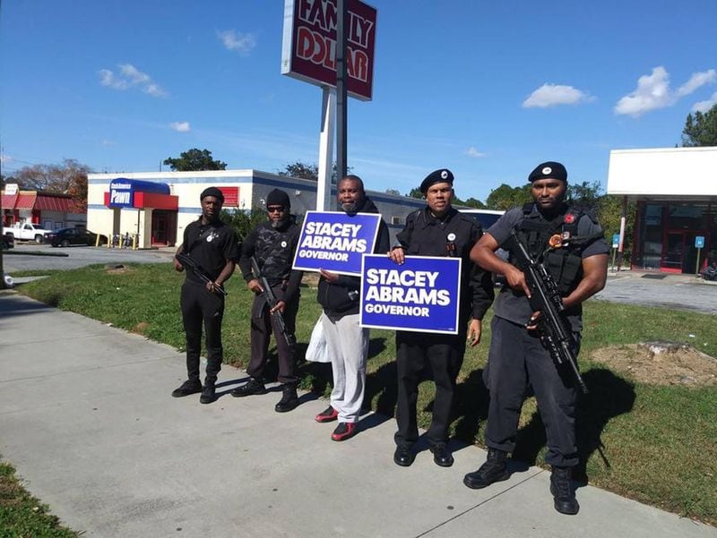 In 2018, the Atlanta chapter of the New Black Panther Party posted this picture on Facebook of members carrying weapons while campaigning for Democratic gubernatorial candidate Stacey Abrams. The Republican candidate, Brian Kemp, shared the photos on his social media accounts the next day. (Facebook)