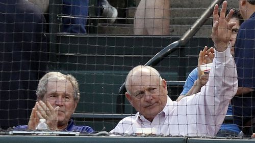 Former President George W. Bush applauds as Nolan Ryan waves the the crowd as the Texas Rangers play host to the Houston Astros at Globe Life Park in Arlington, Texas, on Friday, April 11, 2014. (Richard W. Rodriguez/Fort Worth Star-Telegram/TNS)