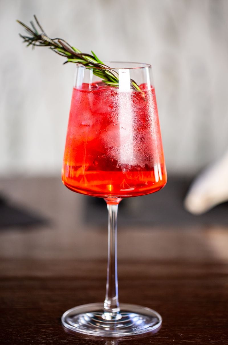 Hibiscus-infused gin is the base for a ruby-red gin and tonic on the winter menu at 26 Thai Kitchen & Bar. Ryan Fleisher for The Atlanta Journal-Constitution