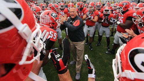 Richt fires up his team as they prepare to play Georgia Tech in their rivalry football game on Nov. 28 in Atlanta. The Dogs won, but Richt was fired the next day. Curtis Compton / ccompton@ajc.com