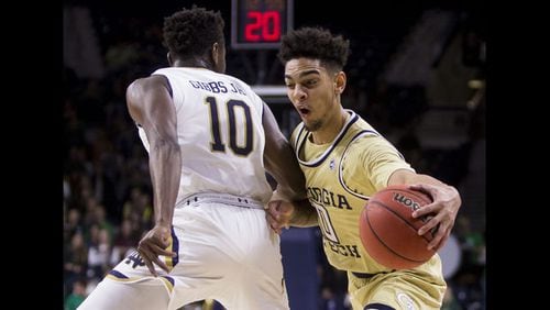 Georgia Tech's Michael Devoe (right) moves by Notre Dame's T.J. Gibbs Jr. (10) during the first half of an NCAA college basketball game Sunday, Feb. 10, 2019, in South Bend, Ind. (AP Photo/Robert Franklin)
