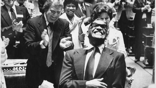 Ray Charles enjoys the ovation he received from a joint session of the Georgia Legislature. The Assembly made his version of the song 'Georgia on My Mind' the official state song after he sang it to the session in 1979.