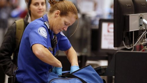 A Transportation Security Administration officer at work. (George Frey/Bloomberg)