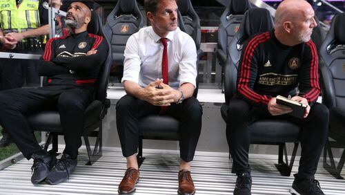 May 12, 2019 Atlanta: Atlanta United head coach Frank de Boer (center) and assistant coaches take the bench for the game against Orlando City in a MLS soccer match on Sunday, May 12, 2019, in Atlanta.  Curtis Compton/ccompton@ajc.com