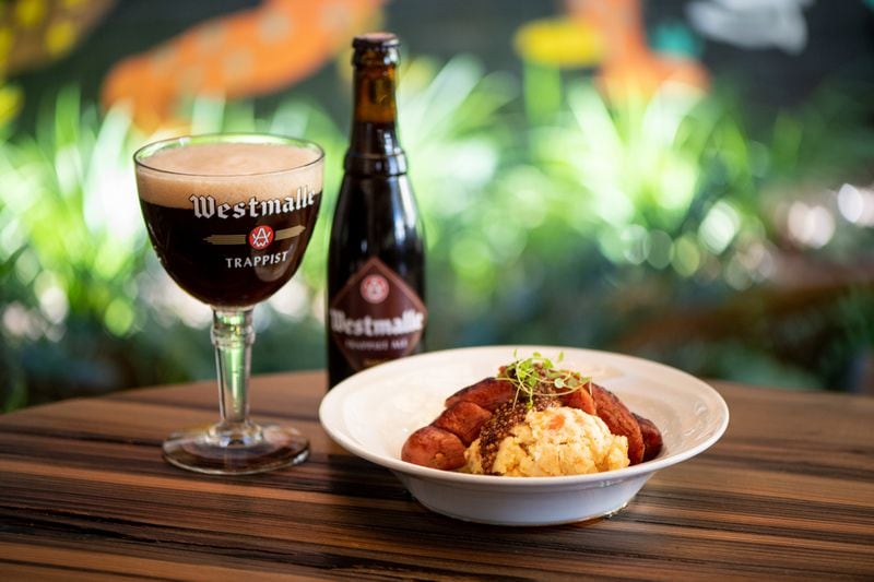 Brick Store Pub Root Vegetable Mash with sausage and pickled mustard seeds, paired with Westmalle Trappist Ale, can be made with any kind of sausage. (Mia Yakel for The Atlanta Journal-Constitution)