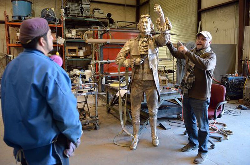 Andy Davis (right) shows off his sculpture of Patrick Henry. (Credit: Andy Davis)