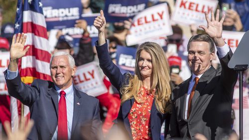 Then-Vice President Mike Pence (left), Senator Kelly Loeffler and Senator David Perdue wave at the crowd gathered during a Defend the Majority Republican rally in Canton in November 2020, when Georgia was in the midst of two U.S. Senate runoffs. Loeffler and Perdue both lost those contests in January 2021, giving Democrats control of the Senate. (Alyssa Pointer / Alyssa.Pointer@ajc.com)