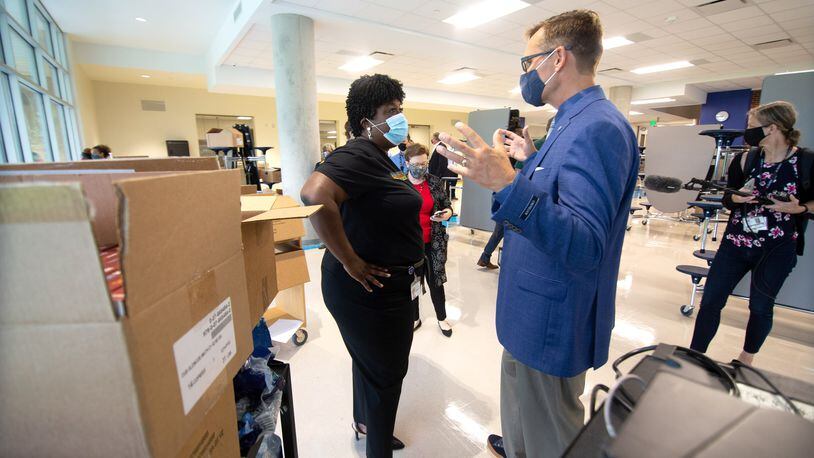 Superintendent Lisa Herring, left, talks with Kevin Maxwell while they tour the renovated David T. Howard Middle School in August 2020. Maxwell was the principal of Howard Middle School until his recent promotion to assistant superintendent for innovation, improvement, and redesign. STEVE SCHAEFER/AJC FILE PHOTO