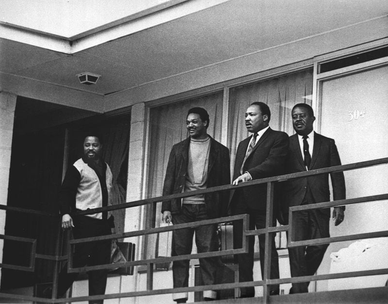 In this April 3, 1968 file photo, the Rev. Martin Luther King Jr. stands with other civil rights leaders on the balcony of the Lorraine Motel in Memphis, Tenn., a day before he was assassinated at approximately the same place. From left are Hosea Williams, Jesse Jackson, King, and Ralph Abernathy. (AP Photo/Charles Kelly, File)