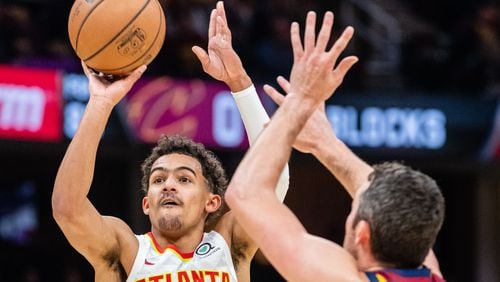 Trae Young of the Atlanta Hawks shoots over Kevin Love of the Cleveland Cavaliers during the second quarter at Quicken Loans Arena on October 21, 2018 in Cleveland, Ohio. (Photo by Jason Miller/Getty Images)