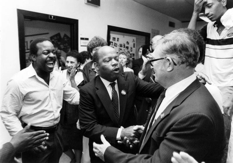 John Lewis is surrounded by supporters during a victory celebration at his headquarters after defeating Julian Bond in runoff for the Democratic nomination in the 5th Congressional District. Wednesday, September 3, 1986. (Kenneth Walker / AJC Archive at GSU Library AJCP452-148g)
