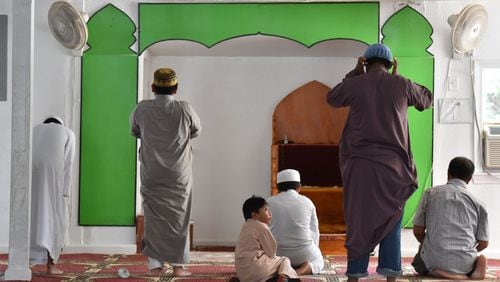 Men pray at Masjid AT-Taqwa in Doraville . HYOSUB SHIN / HSHIN@AJC.COM