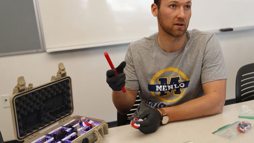 William Mehring, assistant clinical research coordinator for Stanford’s Center for Clinical Research, talks about a mouthguard with sensors built-in to help study concussions on football players at Menlo School in Atherton, Calif., on October 17, 2018. (Nhat V. Meyer/Bay Area News Group/TNS)