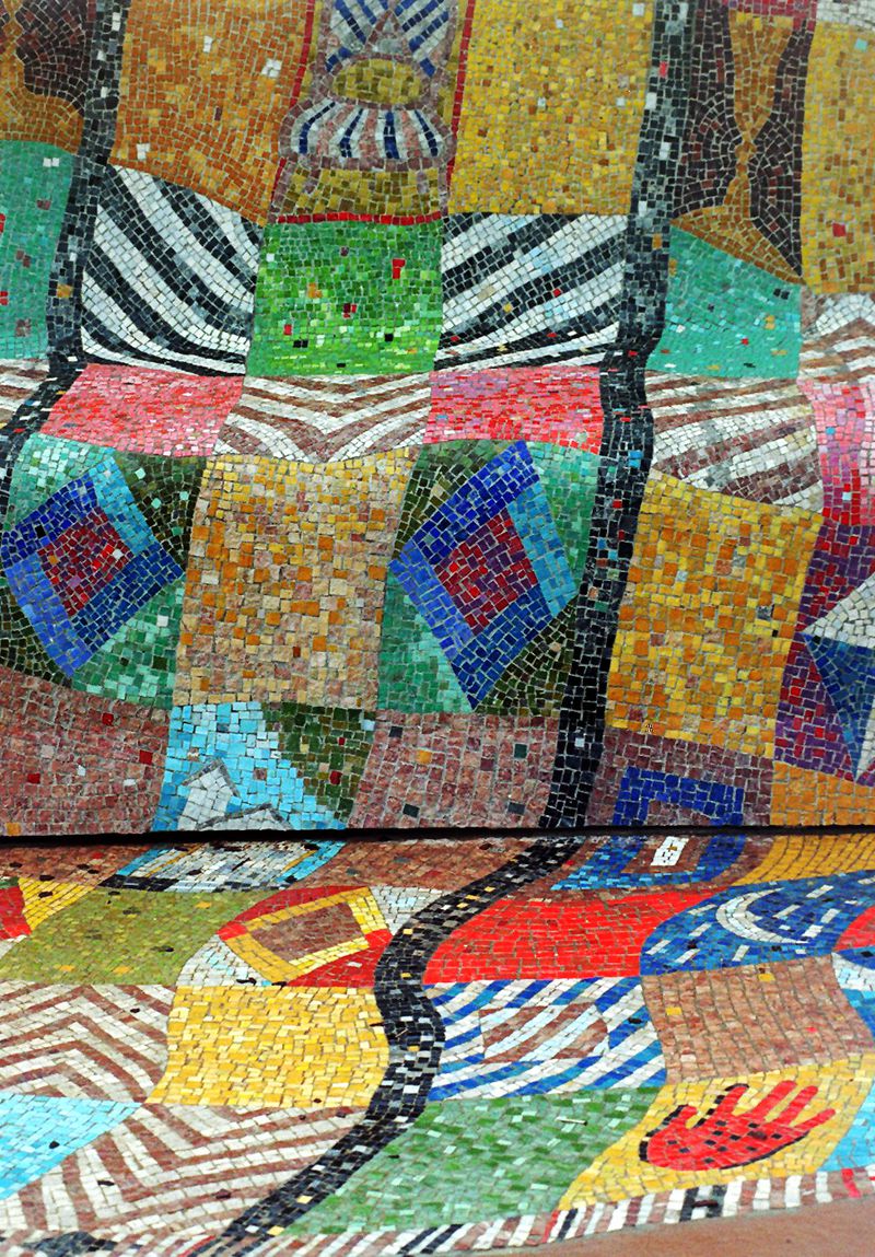A detail of mosaic work on the Emma Amos public art installation called 'We Will Not Forget,' created by the artist for the 1996 Olympics. It is a tribute to the Rev. Ralph Abernathy and is in Abernathy Park. (AJC Staff Photo/Frank Niemeir)