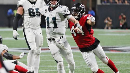 Falcons linebacker Vic Beasley (44) forces Philadelphia Eagles quarterback Carson Wentz (11) to throw incomplete.  Bob Andres / robert.andres@ajc.com