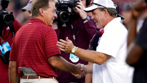 Happier times: Alabama head coach Nick Saban, left, and Texas A&M head coach Jimbo Fisher, right, shake hands during pre-game of an NCAA college football game on Saturday, Oct. 9, 2021, in College Station, Texas. (AP Photo/Sam Craft)