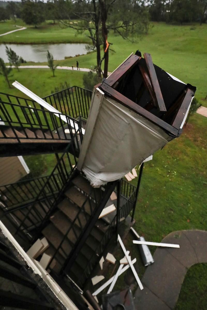 A chimney, blown off a roof by extreme winds, rests in a stairwell at an apartment complex in Tallahassee, Fla., Friday, May 10, 2024. Severe weather hit the Big Bend region of Florida this morning. (AP Photo/Phil Sears)