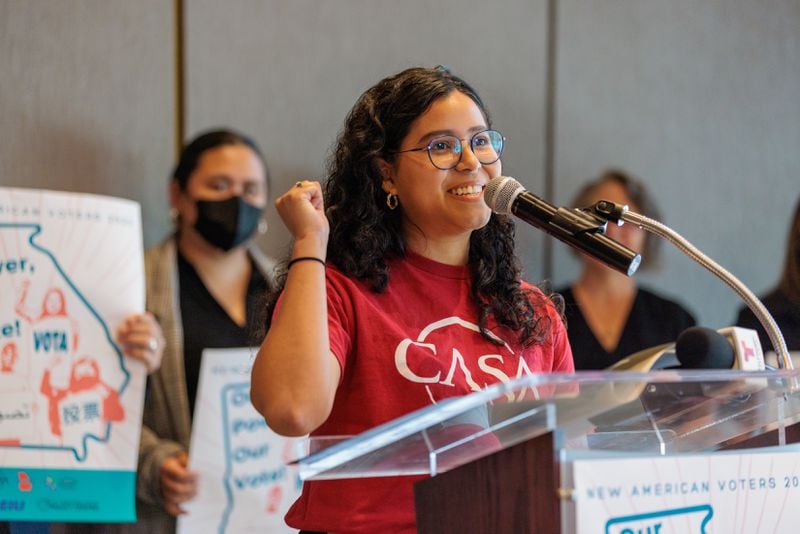 Laura Campos, who was born in Nicaragua and became a U.S. citizen in 2021, speaks at a press conference in Atlanta on Tuesday, August 23, 2022. (Arvin Temkar / arvin.temkar@ajc.com)