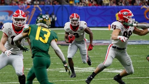 Georgia running back Zamir White (3) was among the young players that made a strong impression for the Bulldogs during last year's Sugar Bowl appearance against Baylor. No. 9 Georgia faces eighth-ranked and undefeated Cincinnati on Friday in Atlanta's Peach Bowl.