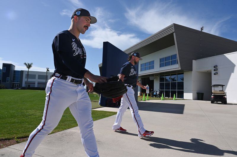 Atlanta Braves starting pitcher Spencer Strider (left) and  relief pitcher Kirby Yates walk to the pitchers mount during Braves spring training at CoolToday Park, Thursday, Feb. 16, 2023, in North Port, Fla.. (Hyosub Shin / Hyosub.Shin@ajc.com)