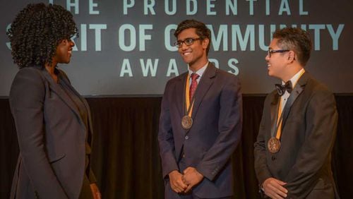 Emmy-winning actor Viola Davis, left, congratulates metro Atlanta students Anish Bikmal, center, and Seth De La Pena at the The Prudential Spirit of Community Awards program in early May 2019.