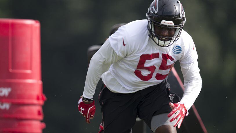 Atlanta Falcons defensive end J.T. Jones (55) runs drill during the team's NFL training camp football practice Friday, July 28, 2017, in Flowery Branch, Ga. (AP Photo/John Bazemore)