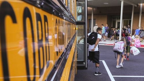 Cobb County schools have rolled out a new app to allow parents to track school buses. (AJC file photo)