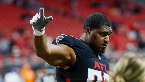 Atlanta Falcons defensive tackle Calais Campbell (93) signals to the crowd as his team warm-up before they face the Tampa Bay Buccaneers on Sunday, Dec. 10, at Mercedes-Benz Stadium in Atlanta.
Miguel Martinez/miguel.martinezjimenez@ajc.com