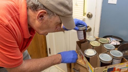 Mike Massey works on making one of his jam recipes in the kitchen of his Decatur home. He gives his homemade jams to the Lawrenceville co-op, a food bank serving Gwinnett & other Counties. PHIL SKINNER FOR THE ATLANTA JOURNAL-CONSTITUTION