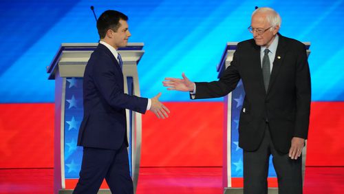Former South Bend, Ind., Mayor Pete Buttigieg, left, and U.S. Sen. Bernie Sanders of Vermont are the front-runners heading into Tuesday’s vote in the New Hampshire Democratic primary. They have focused on each other while trying to deny giving any attention to the other candidates in the field. (Chang W. Lee/The New York Times)