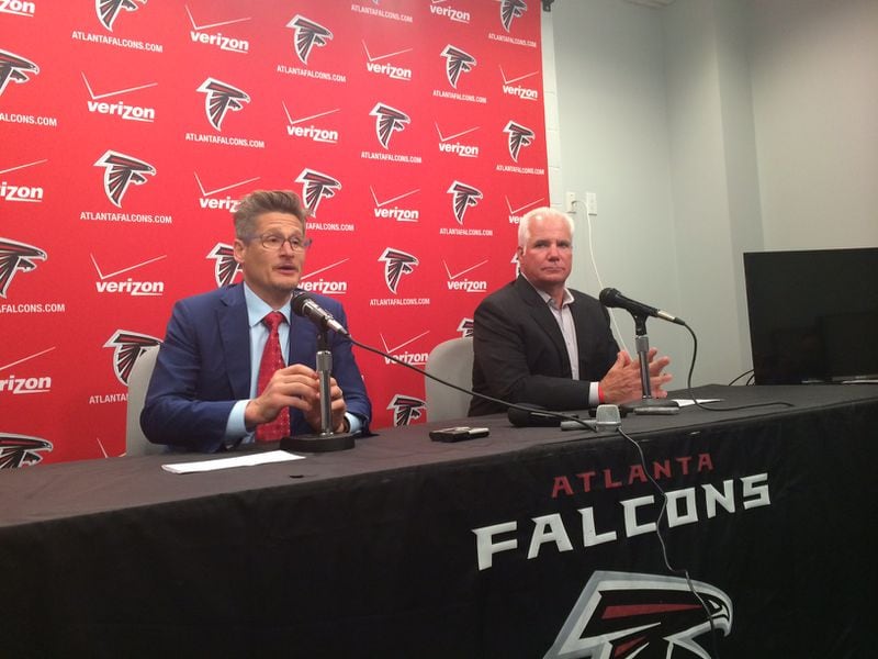 Falcons general manager Thomas Dimitroff and head coach Mike Smith discussing the second and third round picks in May during the draft. (D. Orlando Ledbetter/Dledbetter@ajc.com)