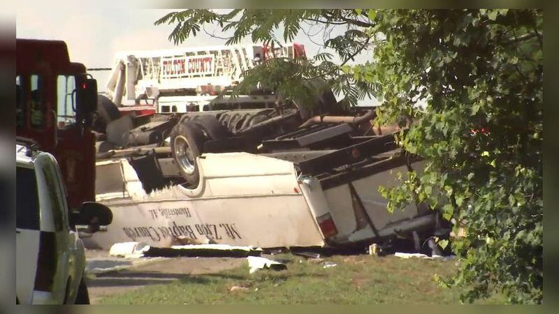 One person is dead nearly a dozen other are injured after an Alabama church bus carrying a youth group crashed into a black sedan Tuesday afternoon. (Credit: Channel 2 Action News)