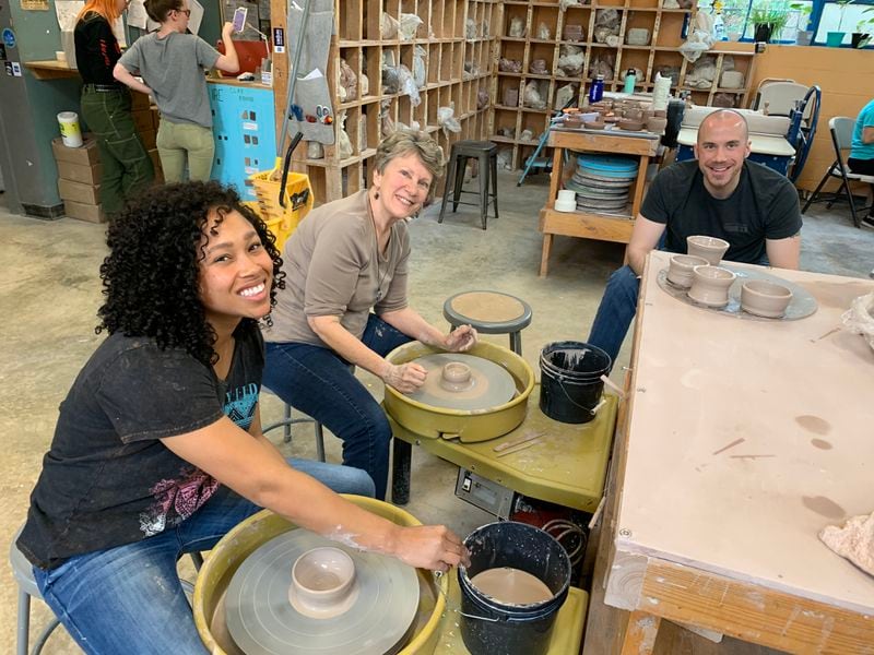 In this pre-pandemic photo, Aaron Stoddard, his wife, Diandra Stoddard, and his mother, Anne Stoddard, are together taking a pottery class. Aaron says that the three of them are planning a Sunday road trip to a winery, and they'll take their masks. (Courtesy of Aaron Stoddard)