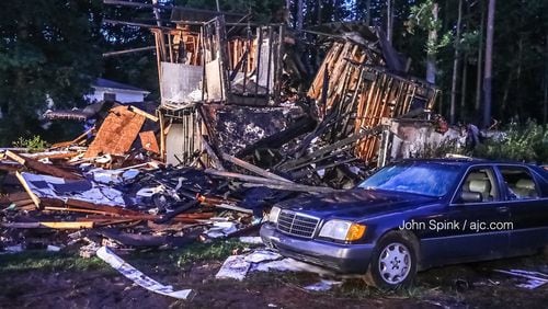 Only wood framing remains after a home on Hasty Lane in the Austell area burned and exploded Sunday night. A father and his 6-year-old son made it out but were  burned, fire officials told Channel 2 Action News.