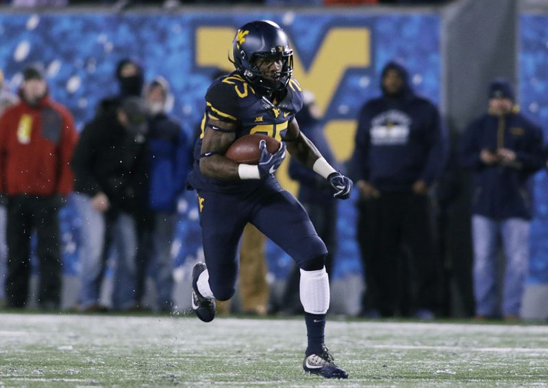 West Virginia running back Justin Crawford (25) during the first half/ second half of an NCAA college football game, Saturday, Nov. 19, 2016, in Morgantown, W.Va. (AP Photo/Raymond Thompson)