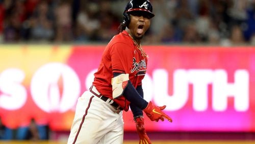 Braves second baseman Ozzie Albies reacts after hitting a two-RBI double during the seventh inning against the Miami Marlins at Truist Park Friday, May 27, 2022, in Atlanta. (Jason Getz / Jason.Getz@ajc.com)